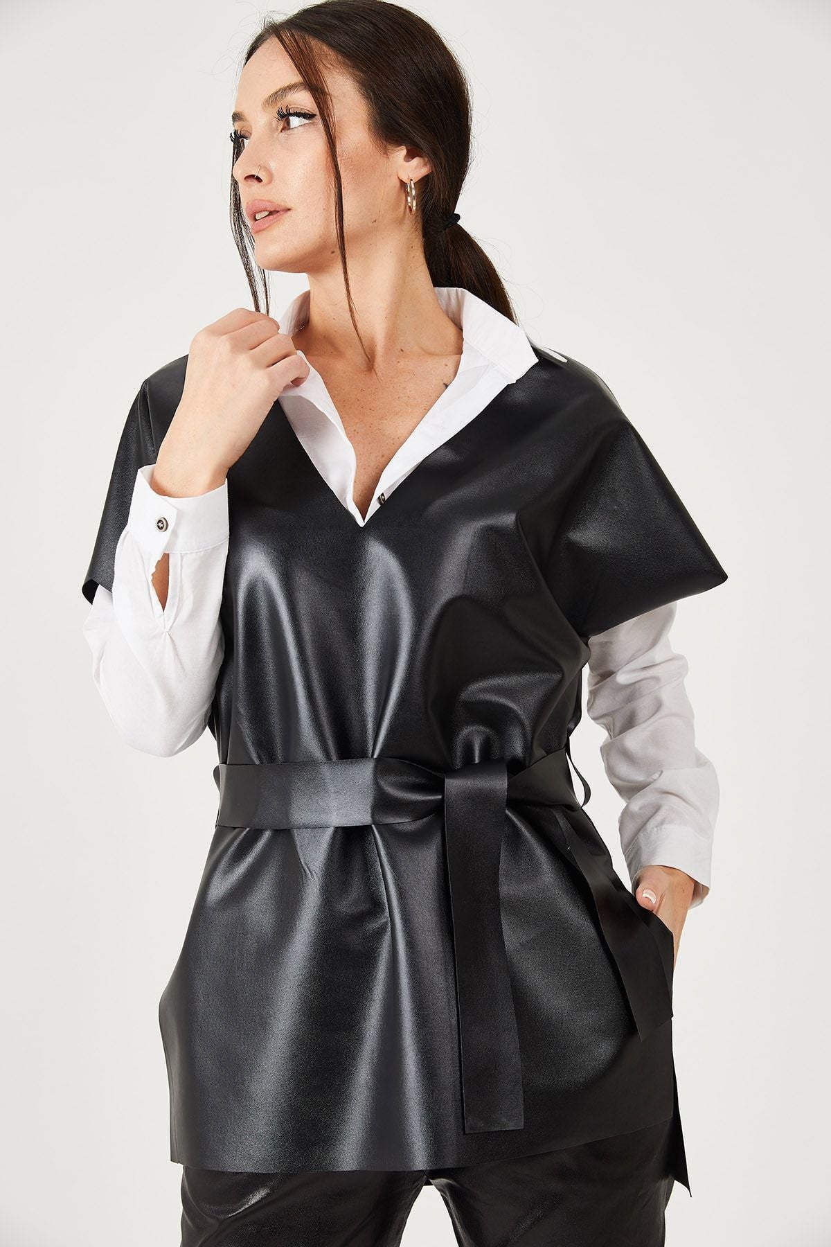 Female black v neck leather-looking front short back long-belted blouse ARM-21K001054