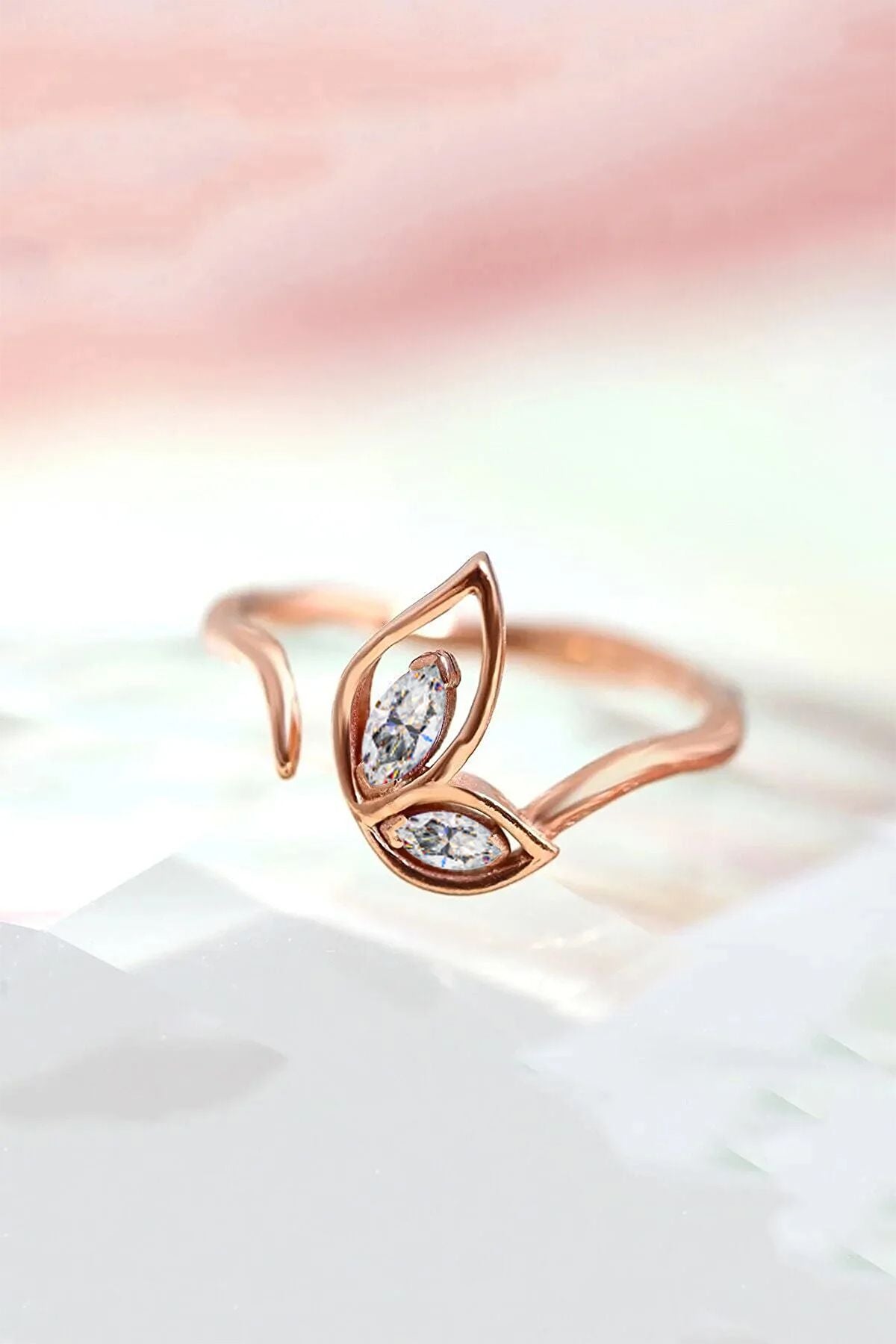 14K Rose gold plated adjustable size female ring with white stone wings motif