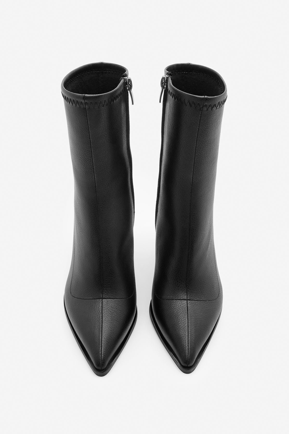 Woman heeled boots pointed nose glass