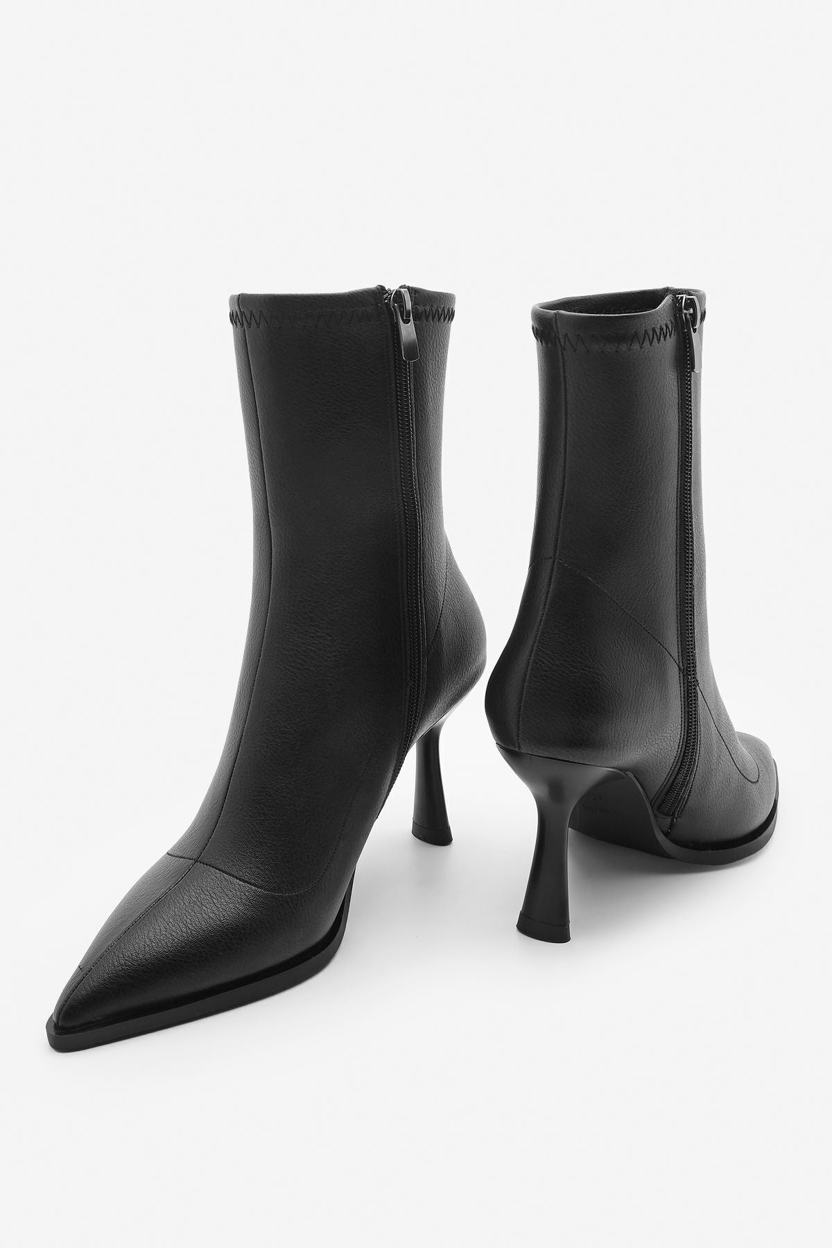 Woman heeled boots pointed nose glass