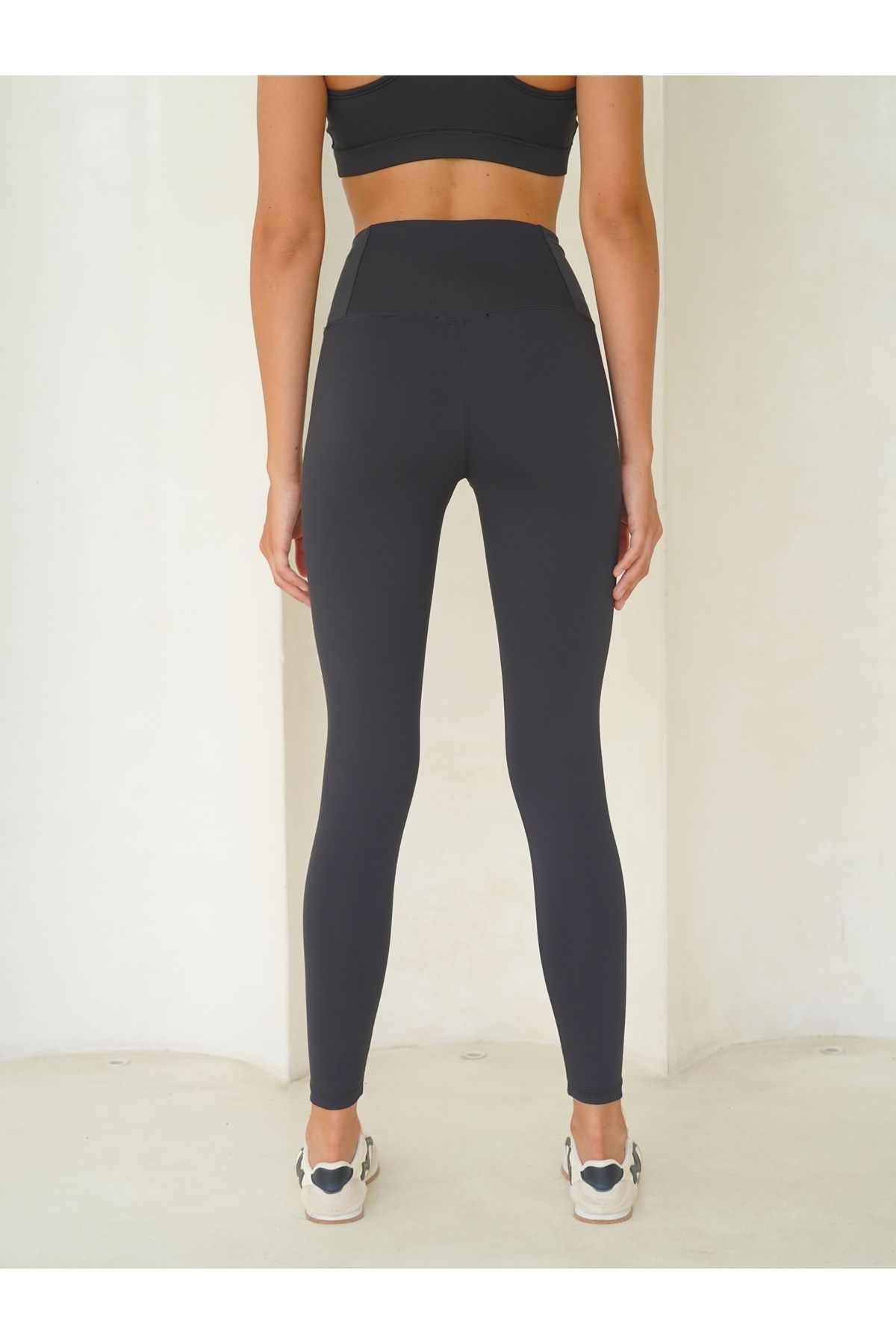 Black tights at fold wrist level
