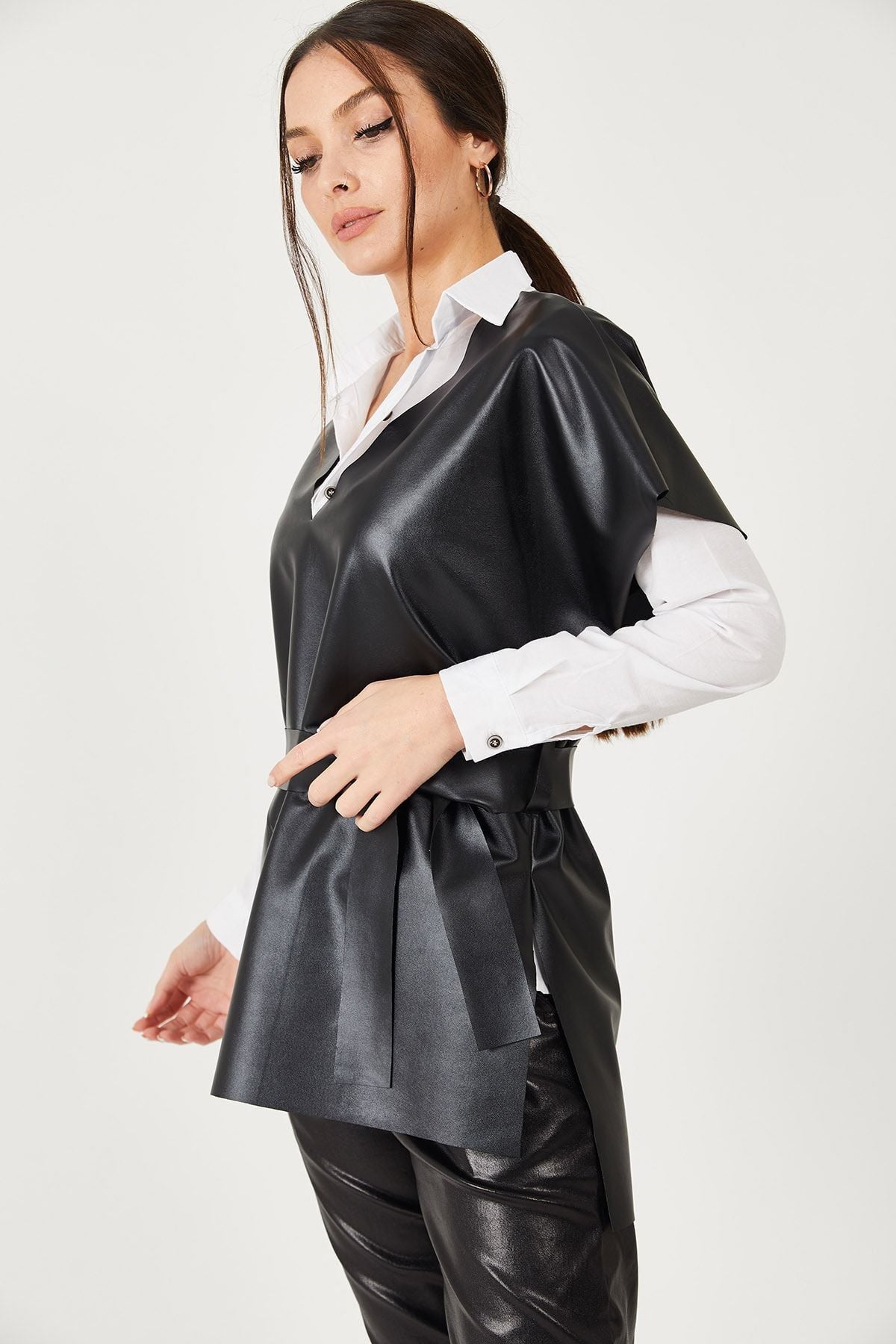Female black v neck leather-looking front short back long-belted blouse ARM-21K001054
