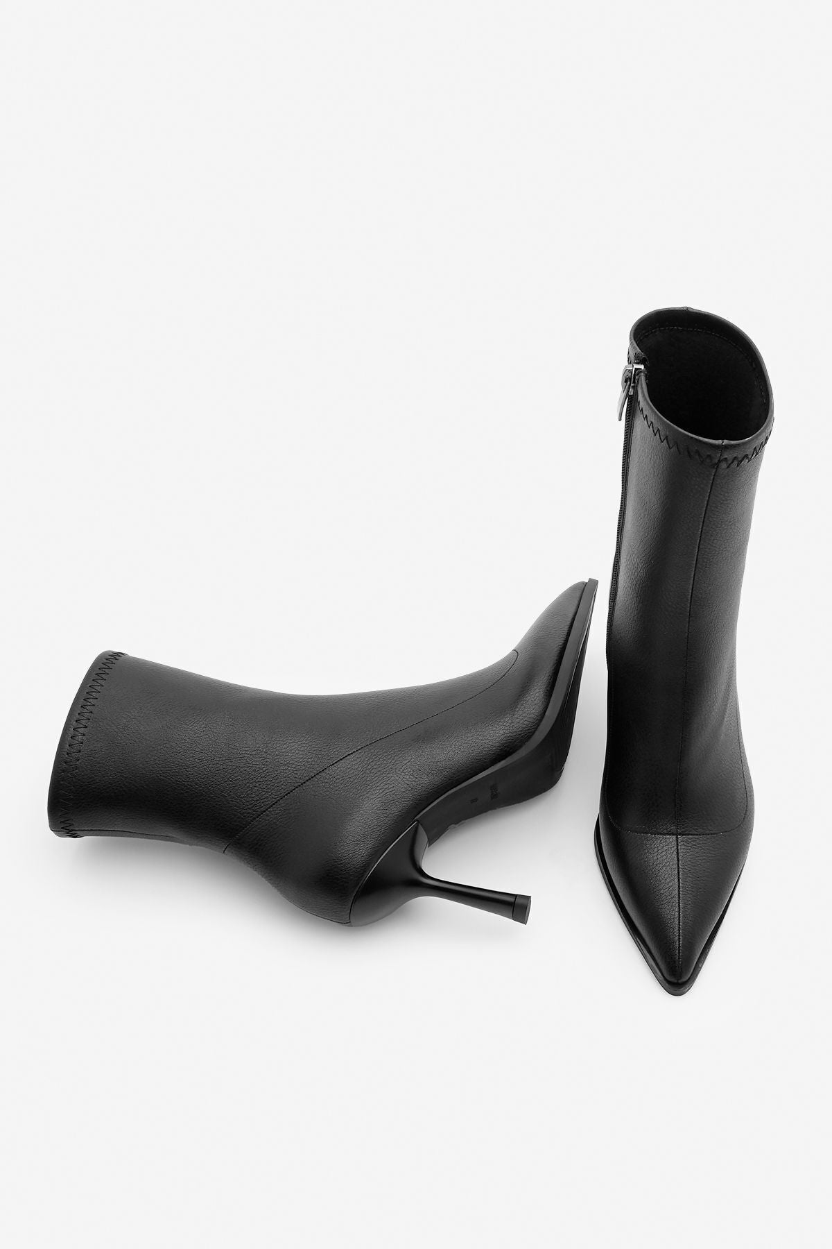 Woman heeled boots pointed nose glass