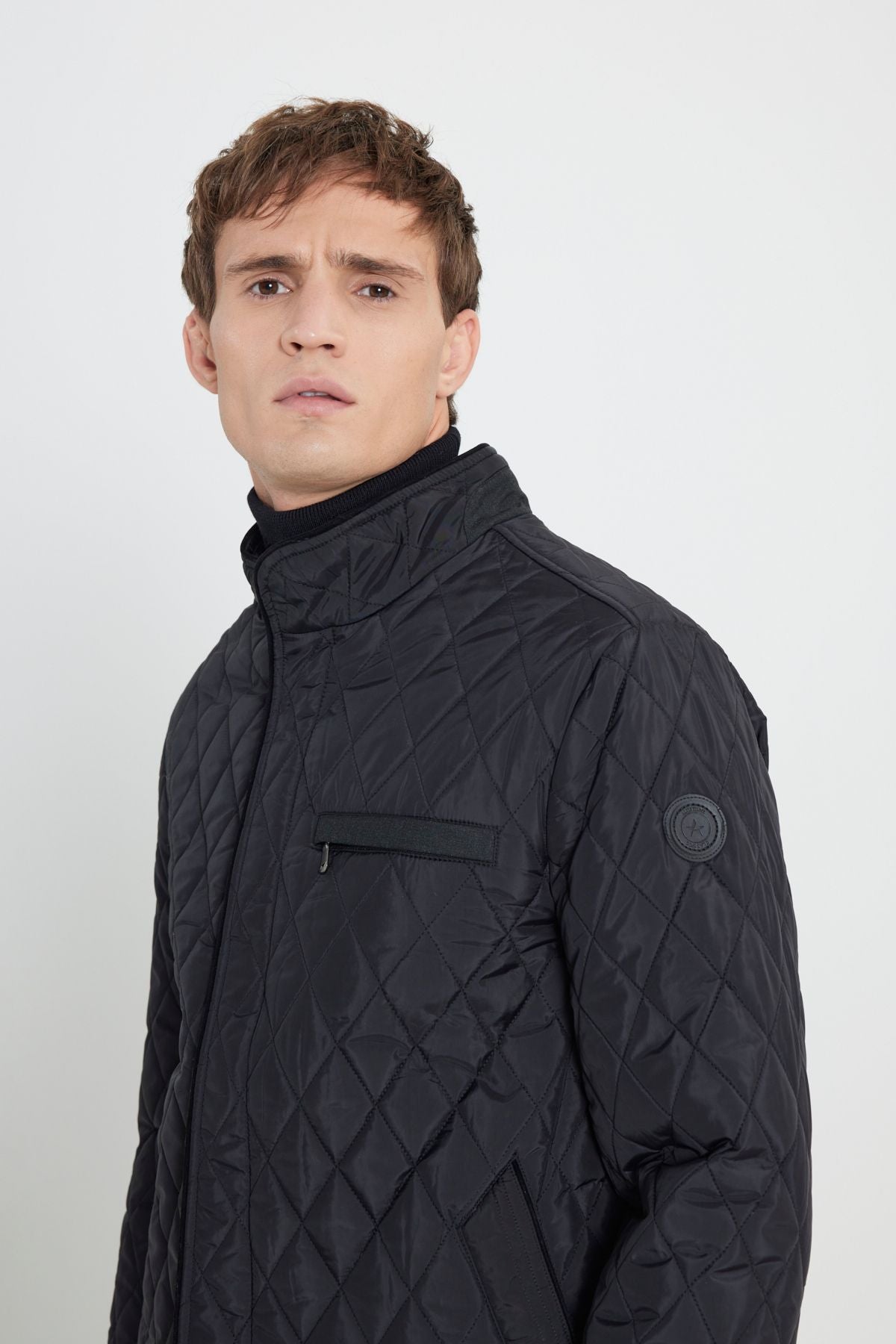 Men's black standard fit normal cut upright collar pattern overcoat