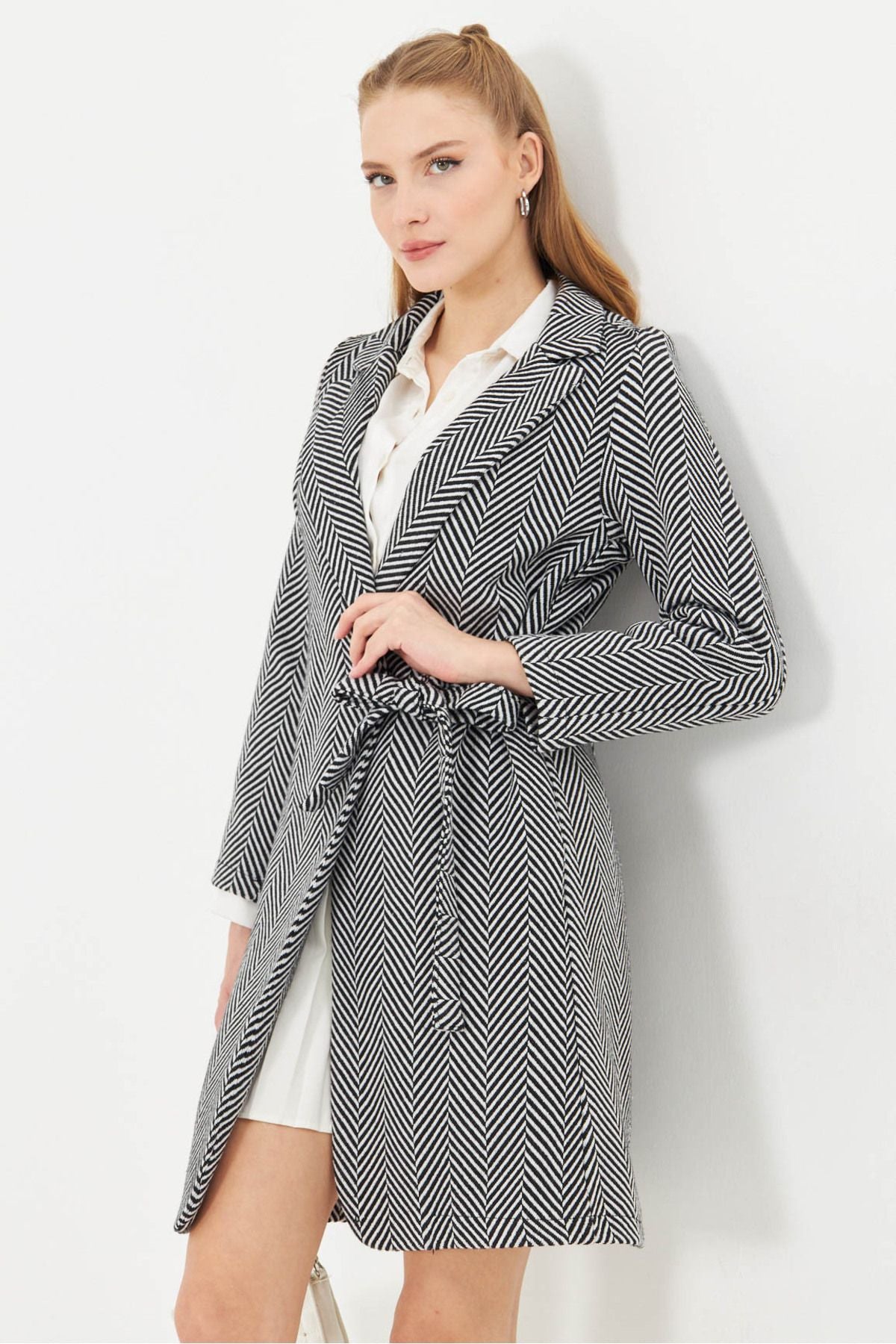 Women's black side-tied pocket long stamp coat with striped pockets ARM-25K001077