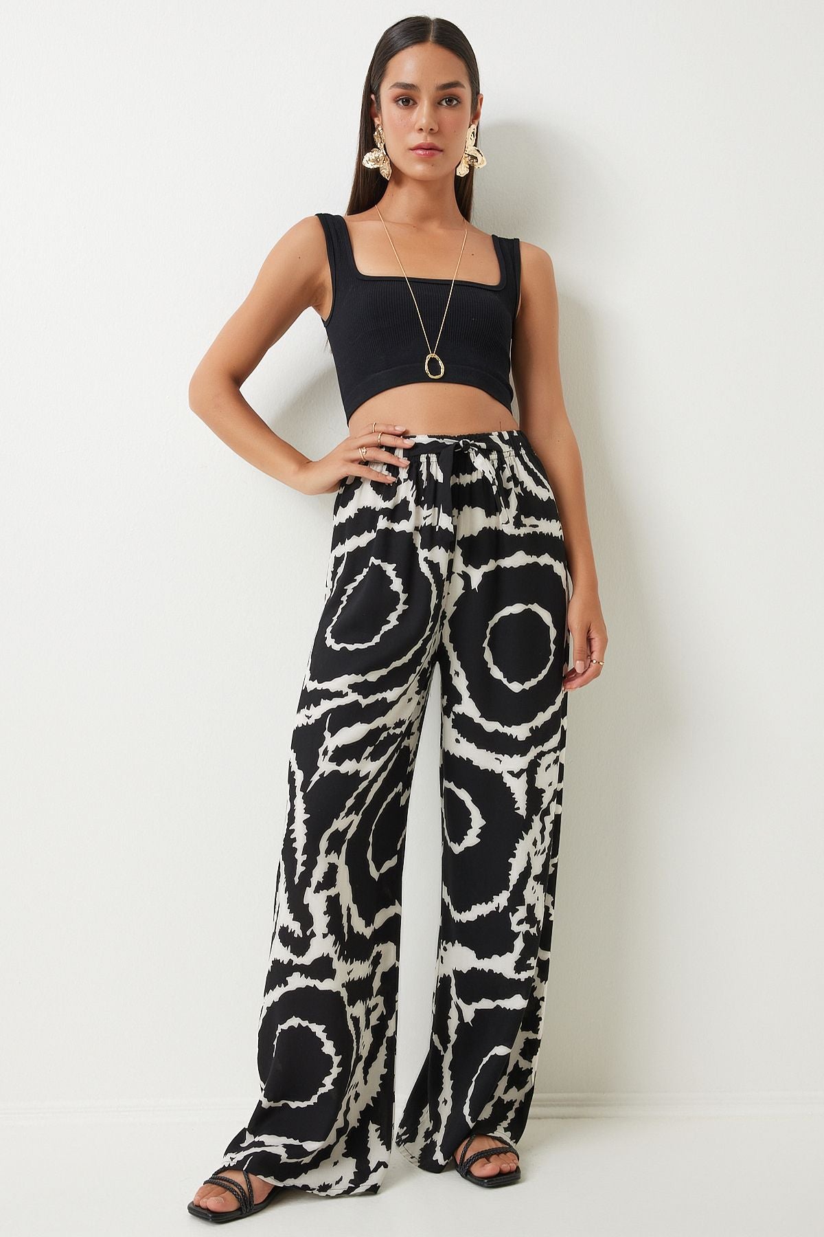 Female black light cream pattern draped viscose palazzo pants EN00606