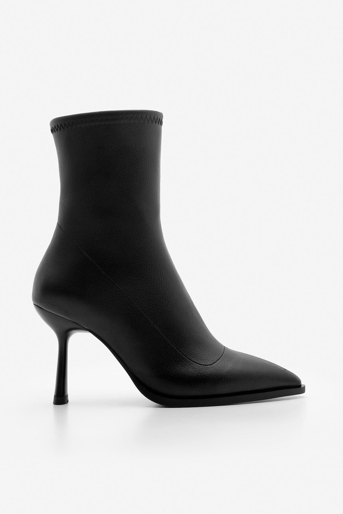 Woman heeled boots pointed nose glass