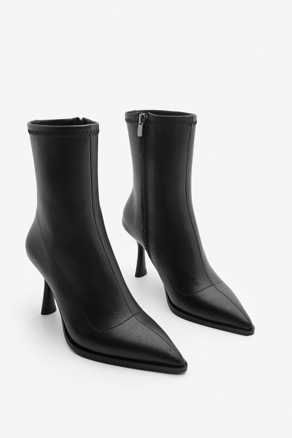 Woman heeled boots pointed nose glass