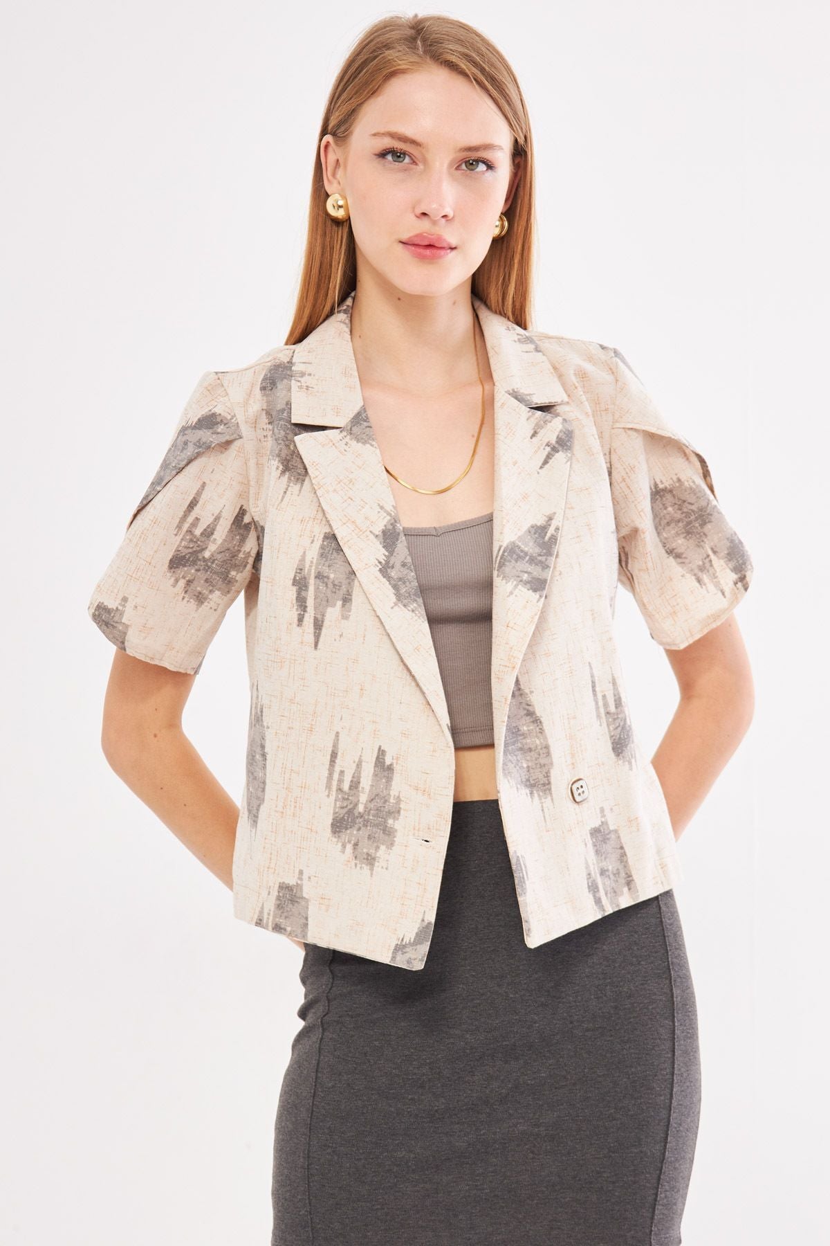 Female smoked linen looking patterned arm slit and short sleeve jacket ARM-24Y001095