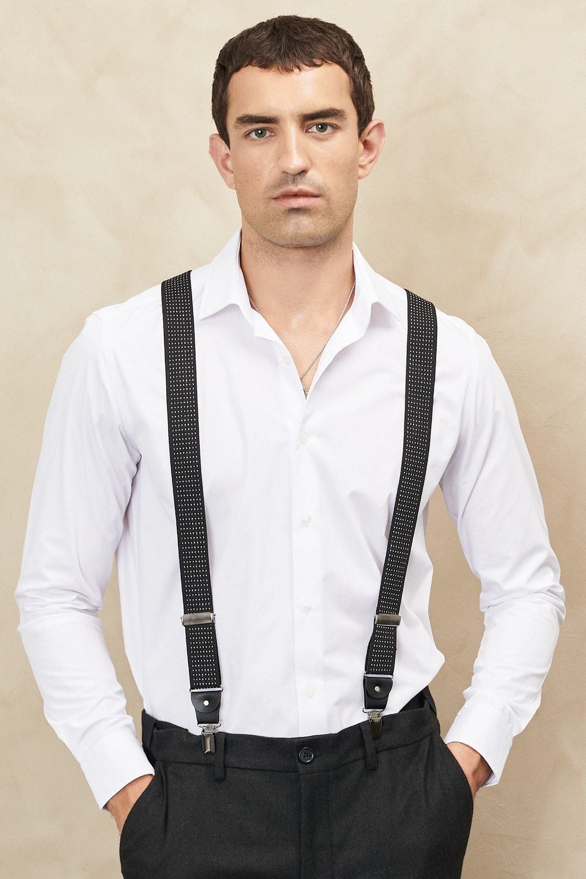 Men's black-and-white patterned trousers strap