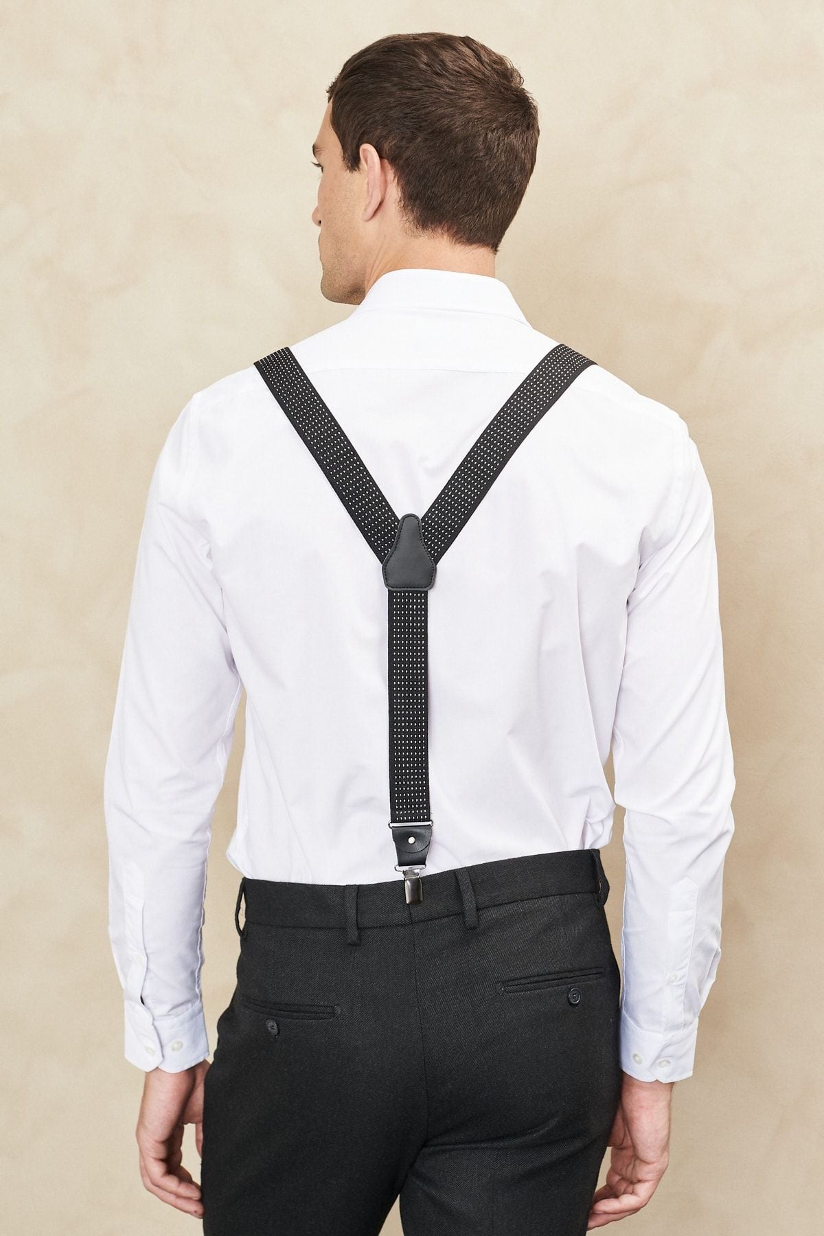 Men's black-and-white patterned trousers strap