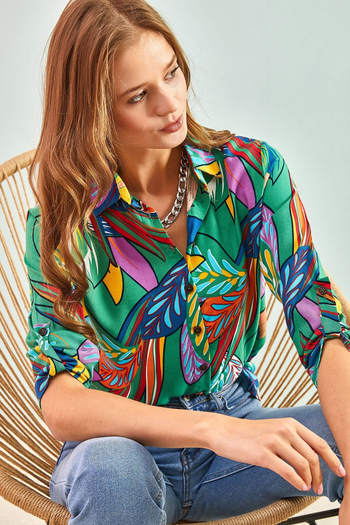Female multi leaf patterned arm folding viscose shirt
