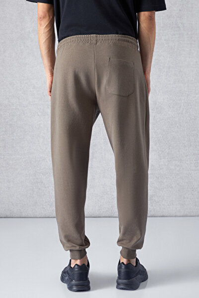 PEPO Men's Relaxed Dark Brown Sweatpants with Elastic Waist Pockets and Zipper Print Detail
